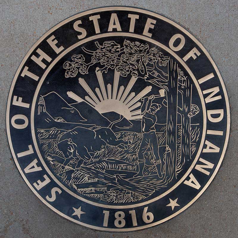 The seal of the state of Indiana is visible on the sidewalk outside the St. Louis Fed.
