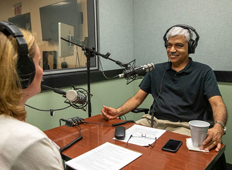 B. Ravikumar being interviewed by Kristie Engemann.