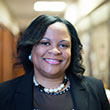 Woman with dark hair in business attire