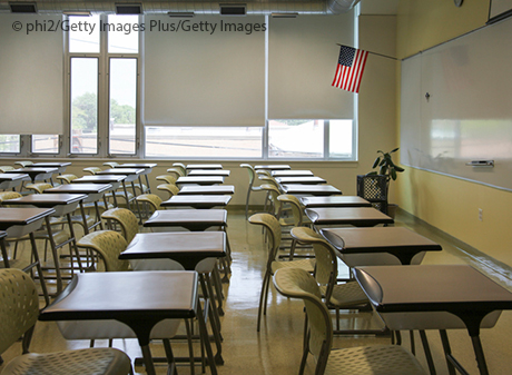 empty classroom with U.S. flag