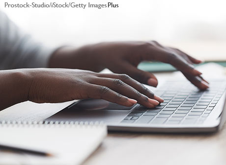 woman's hands typing