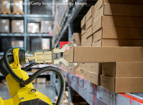 yellow robotic arm carry cardboard box in warehouse