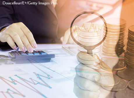 Woman analyzing stock charts.