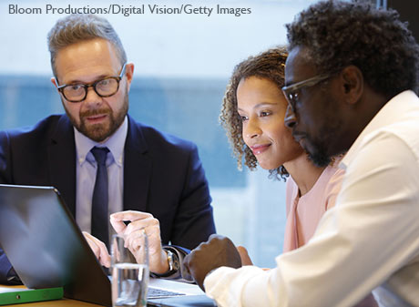 Financial advisor having a meeting with clients - stock photo