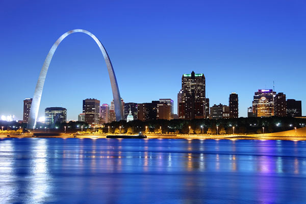A night view of the Gateway Arch in the St. Louis skyline.