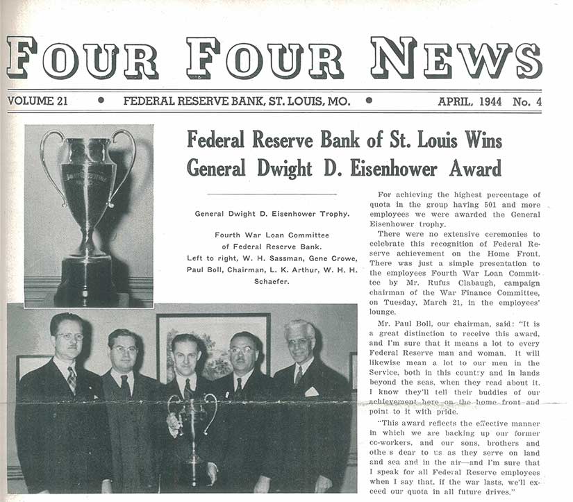 Newspaper’s front page has  black and white photos of a trophy and of five men in suits holding it.