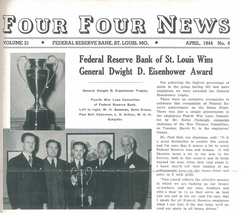 Newspaper’s front page has black and white photos of a trophy and of five men in suits holding it.