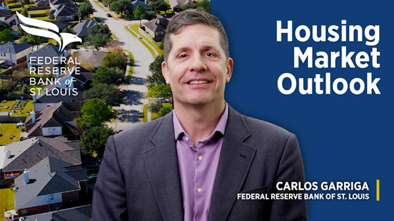 An image shows a man in business attire and includes the text “housing market outlook” and “Carlos Garriga, Federal Reserve Bank of St. Louis” along with the Federal Reserve Bank of St. Louis logo.