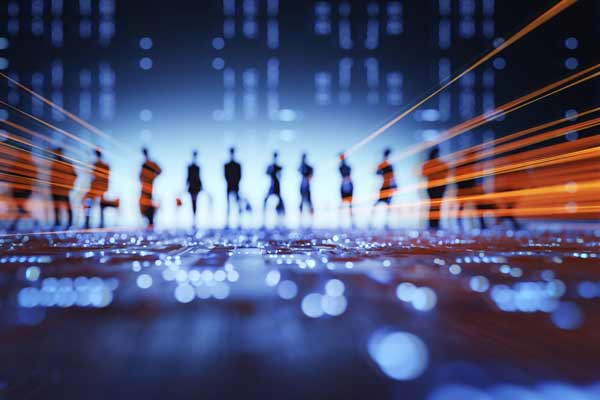 Workers stand on a blue computer chip with bites and data accentuated in orange.