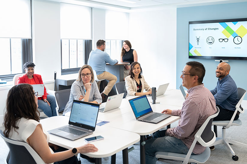 A group of colleagues working in a boardroom.