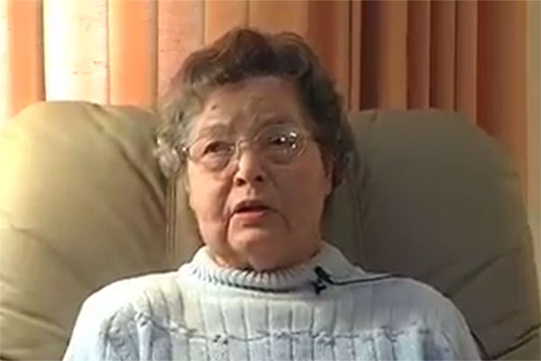Margaret Barrett, born in 1917, speaks while comfortably seated.