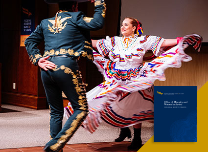 A man and women in traditional Hispanic clothing dance.
