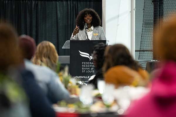 Woman addresses attendees at supplier diversity event.