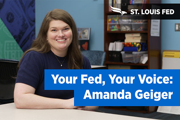Amanda Geiger smiles next to a 'Your Fed, Your Voice' banner.