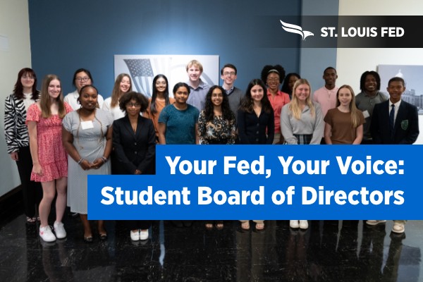 Young students pose for a group photo with St. Louis Federal Reserve staff.