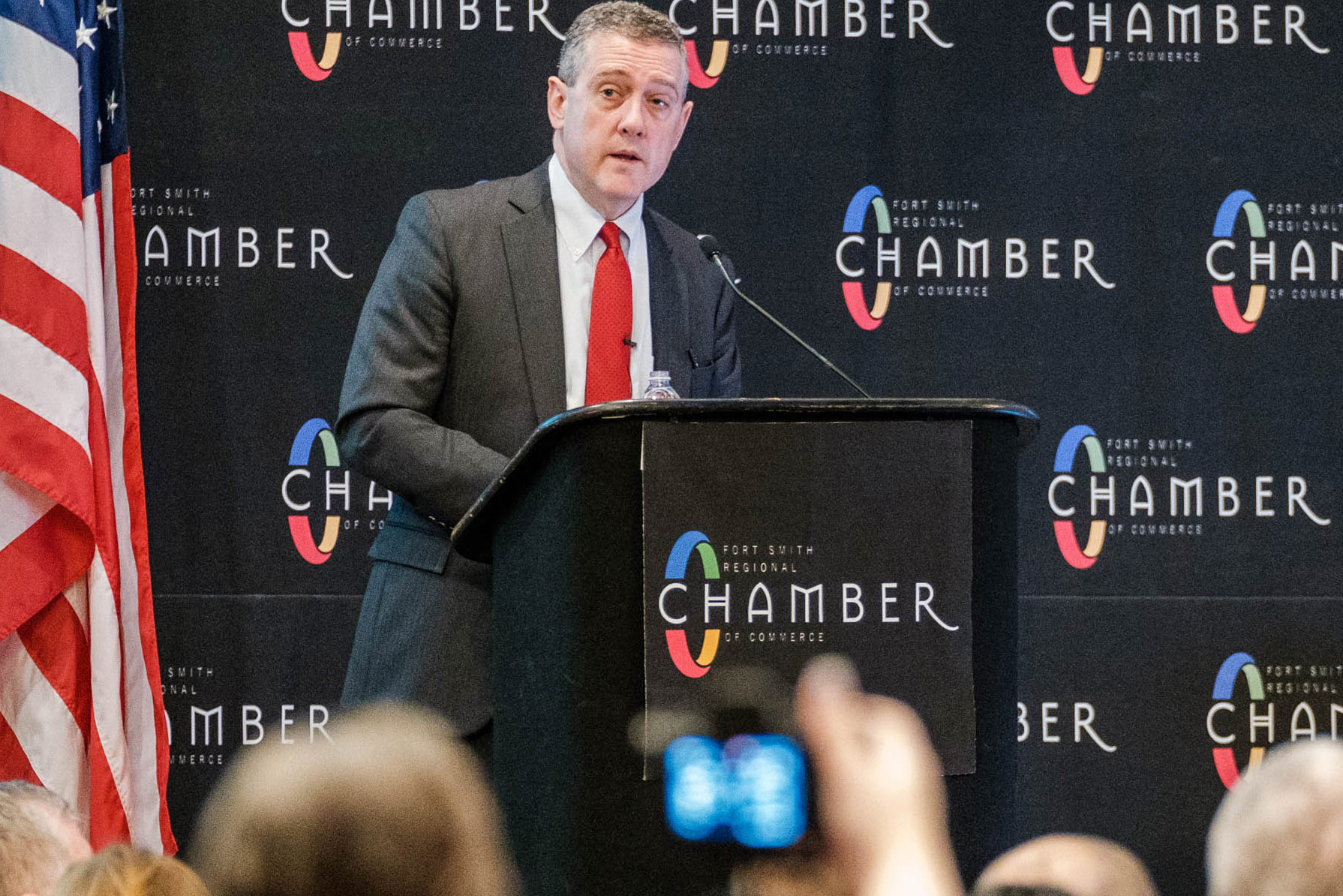 Jim Bullard speaks from behind a podium