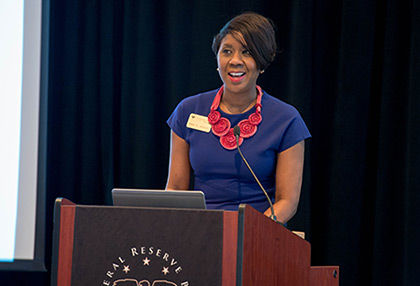 Nikki Jackson speaks at a podium.