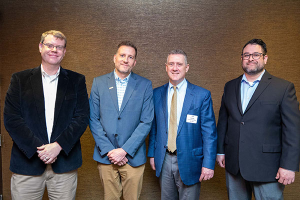 St. Louis Fed President Jim Bullard, Andrew Zumwalt, Graham McCaulley and Marco Pantoja