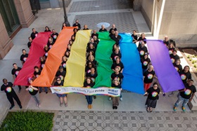 St. Louis Fed employees create a pride flag in bank plaza