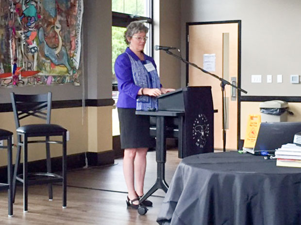 Photo of Annie Donovan, director of the U.S. Treasury Department's CDFI Fund, speaking at Reviving Louisville's Distressed Neighborhoods: The Role of CDFIs | St. Louis Fed