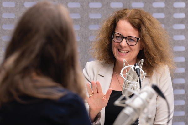 Isabel Schnabel speaking in a recording studio.