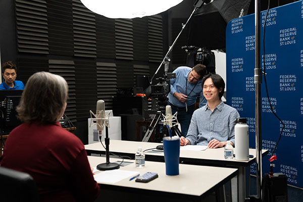 Yu-Ting Chiang in a recording studio sitting across from host Shera Dalin.