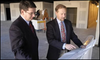 Jim Brasunas and Matthew Kulig look at blueprints