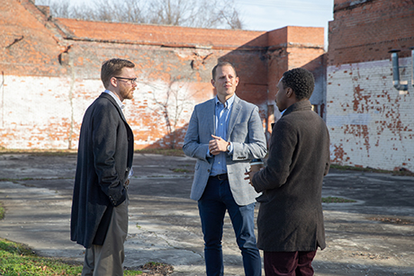 From left: Andrew Dumont, senior community development analyst at the Federal Reserve Board of Governors, Daniel Paul Davis, vice president and community affairs officer at the St. Louis Fed, and Tim Lampkin, CEO of Higher Purpose Co., chat during a stop in Clarksdale, Miss.