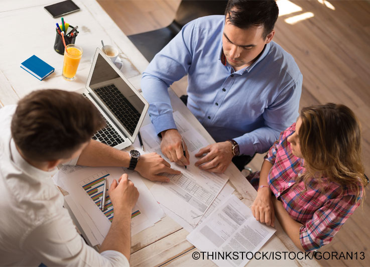 Young couple with financial advisor