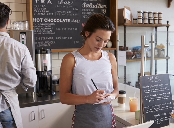 Hispanic waitress at counter