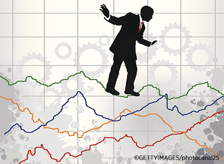 Businessman over a graphics chart, in equilibrium
