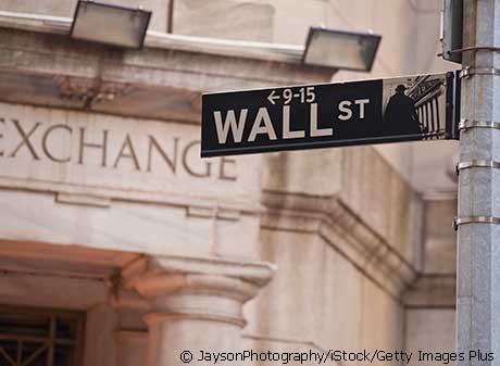 Photo of Wall Street sign in front of Stock Exchange building