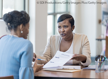 Black female loan officer in discussion with client