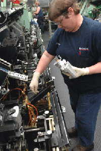 At the Akebono Brake Corp. plant, Barbara Hardesty assembles disc brakes. | St. Louis Fed