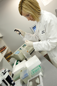 A lab technician at Kentucky BioProcessing, Jill Atherton, prepares to test proteins.