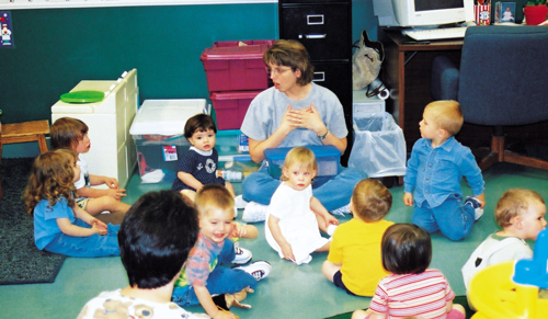 Children listen and learn at a day-care center operated by KCARC. | St. Louis Fed