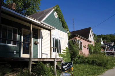 These houses along Walnut Street, just a block from downtown, await a rehabber or developer. | St. Louis Fed