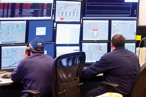 At the Plum Point Energy Station, employees monitor operations of the coal-fired power plant via a bank of computer screens.
