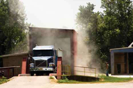 A truck delivers grain from nearby farm fields to Osceola’s port.