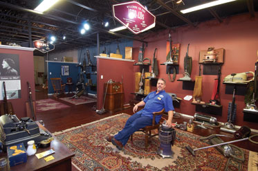 Tom Gasko relaxes at Tacony’s vacuum cleaner museum.