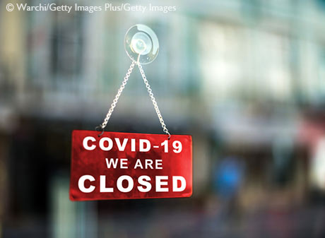 Stock image of closed business due to Coronavirus sign