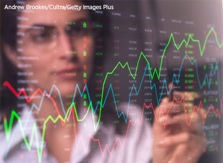 Woman reviewing stock market data