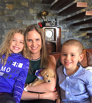 Economist Paulina Restrepo-Echavarria with family and puppy