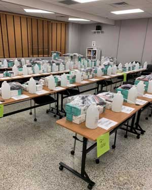 rows of tables hold bottles and boxes