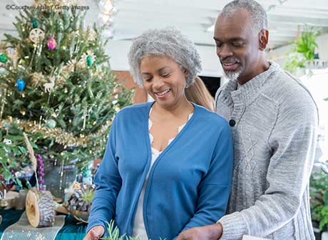 Older couple gazing at holiday merchandise in a small business