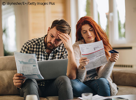 Young couple is annoyed about bills.