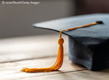 Close up black graduation cap and yellow tassel