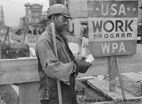 Male receiving paycheck after working WPA job.